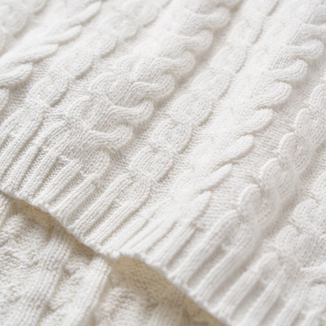 Whisper white horseshoe cable blanket
